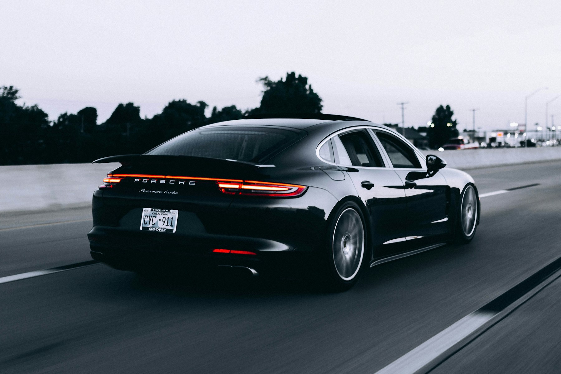 Black sports sedan on a road; editorial stock photograph, not work performed by Zero Grime